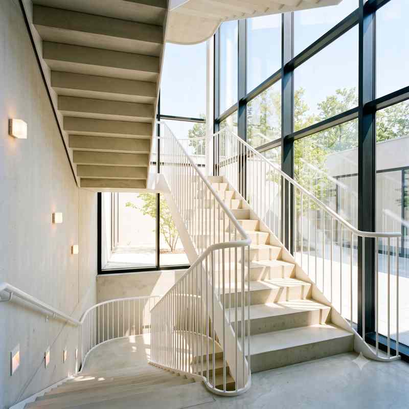 Bright glass stairwell filled with natural light
